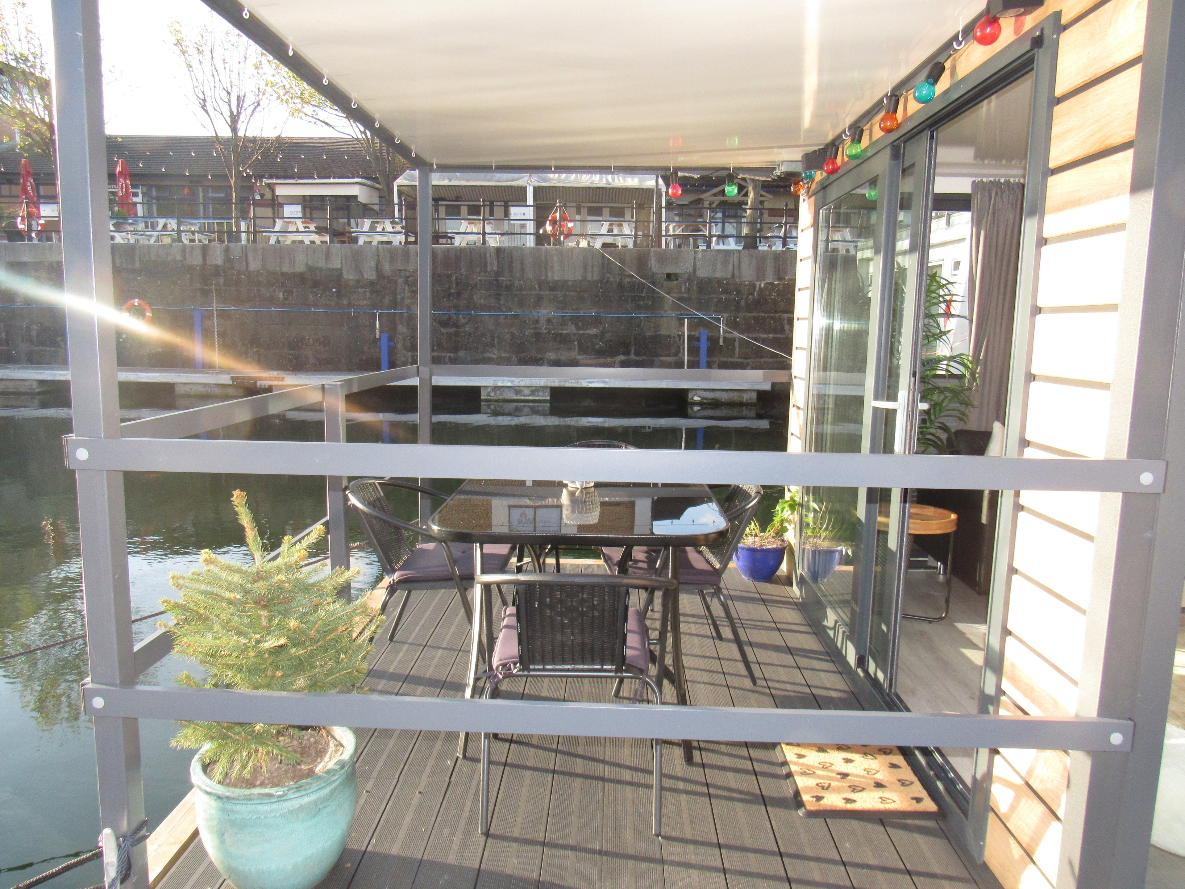 Balcony in daylight with outdoor seating and water views
